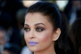 Aishwarya Rai Bachchan experiments with make-up by sporting a very bold purple coloured lips for her third red carpet appearance at Cannes 2016