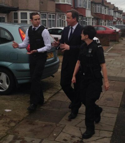 PM David Cameron with Immigration officers during a raid of "beds in sheds" in west London